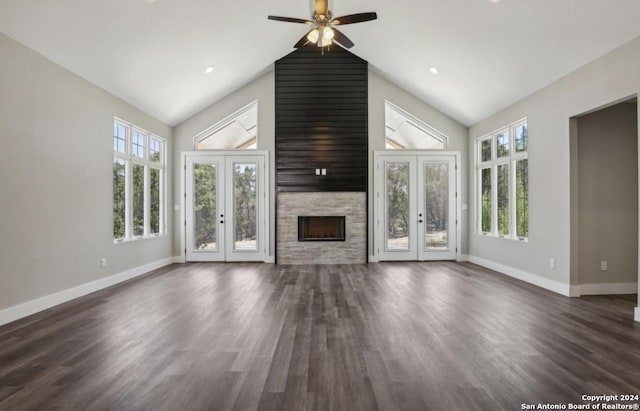 unfurnished living room with french doors, a wealth of natural light, and dark wood-type flooring