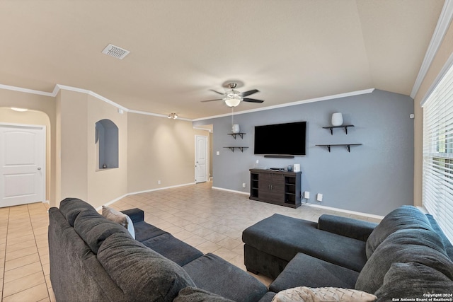 tiled living room featuring ceiling fan, crown molding, and vaulted ceiling