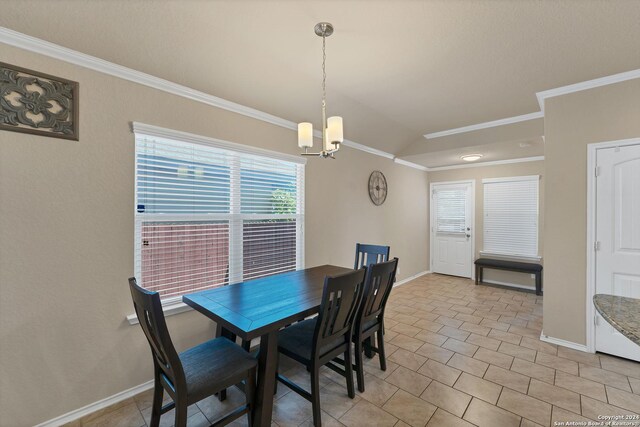 tiled dining room with an inviting chandelier, vaulted ceiling, and ornamental molding