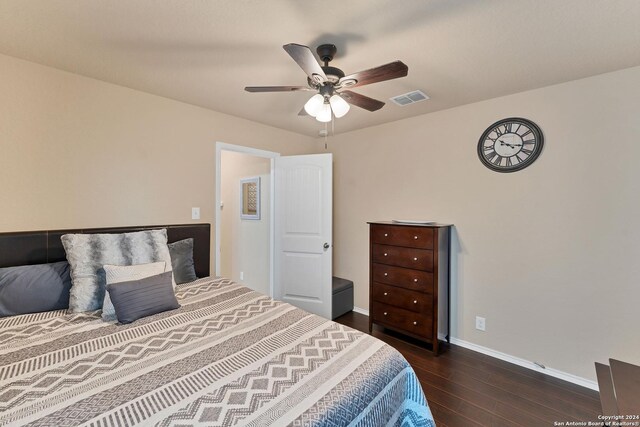 bedroom featuring ceiling fan and dark wood-type flooring