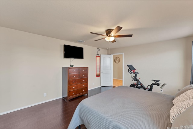 bedroom with ceiling fan and dark hardwood / wood-style floors