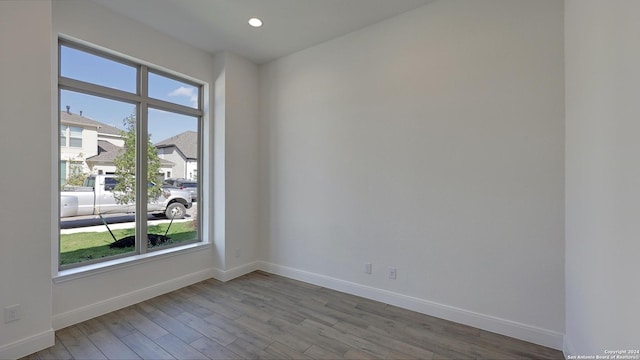 unfurnished room with light hardwood / wood-style floors