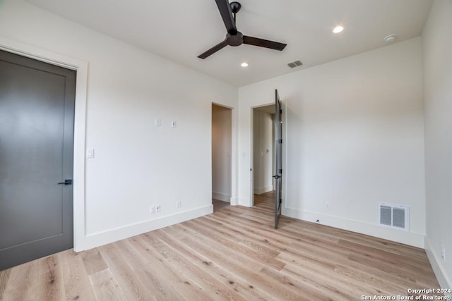 unfurnished bedroom with light hardwood / wood-style flooring and ceiling fan