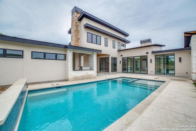 back of house with a patio area