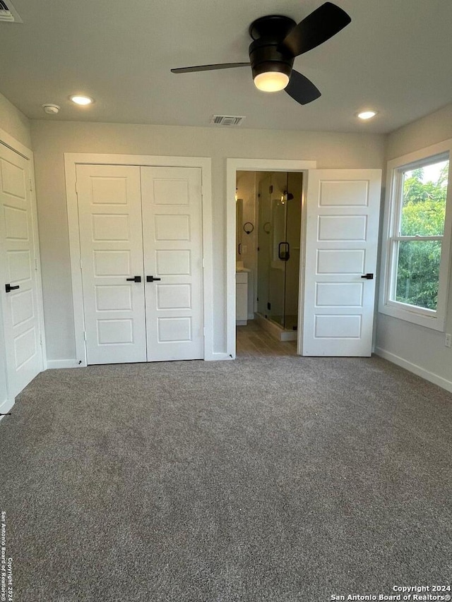 unfurnished bedroom featuring ceiling fan and carpet flooring