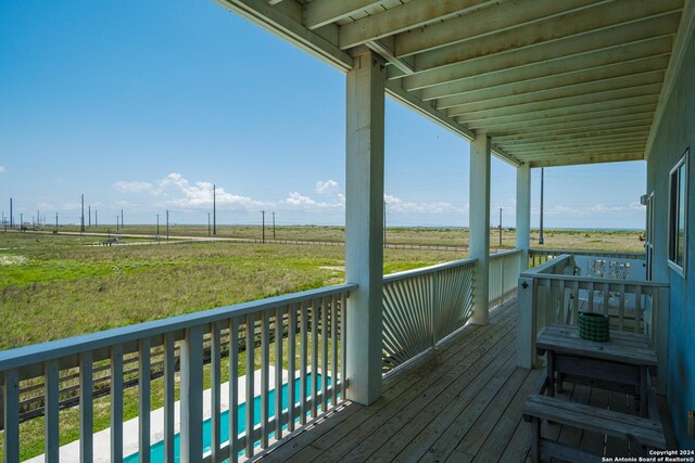 wooden terrace with a rural view