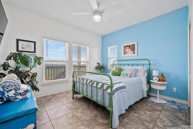 bedroom with tile patterned floors and ceiling fan