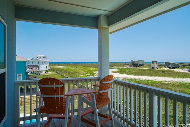 balcony featuring a water view