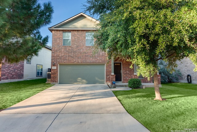 view of front of property with a front lawn and a garage