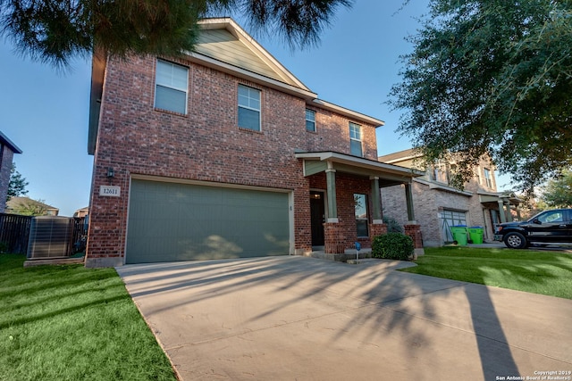 view of front of house featuring a garage and a front yard