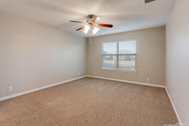 carpeted empty room with ceiling fan