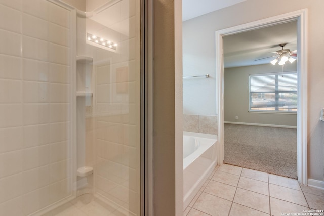 bathroom with tile patterned floors, ceiling fan, and plus walk in shower