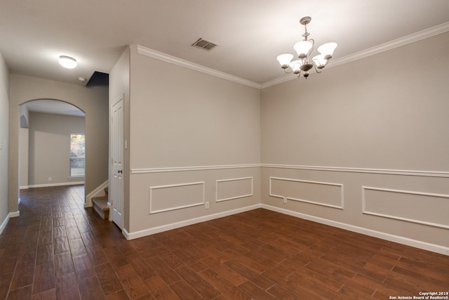 unfurnished room with a chandelier and ornamental molding