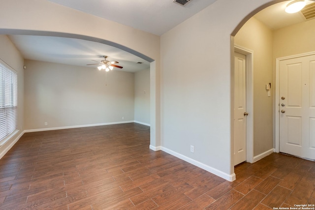 unfurnished room with ceiling fan