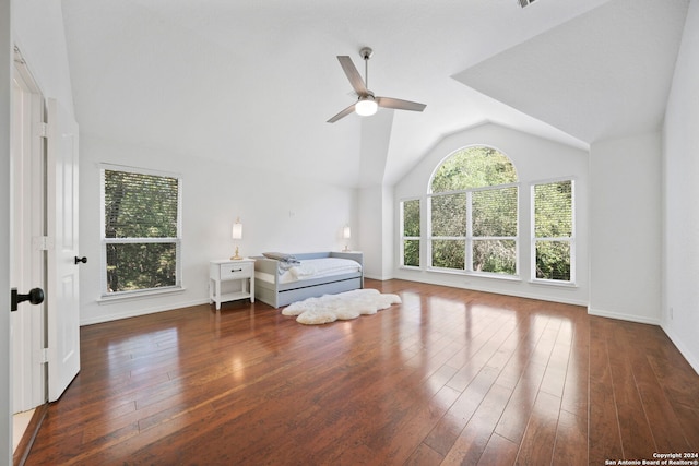 unfurnished bedroom with ceiling fan, dark hardwood / wood-style flooring, and vaulted ceiling