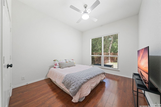 bedroom featuring ceiling fan and dark wood-type flooring