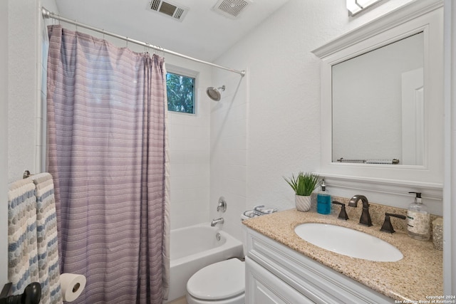 full bathroom featuring toilet, vanity, and shower / bath combo