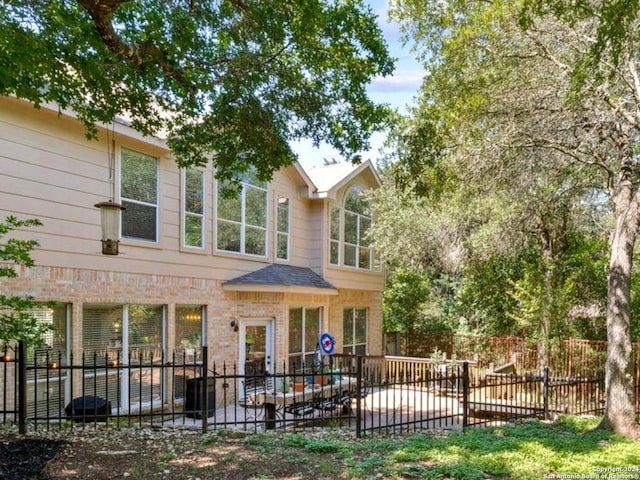 rear view of house featuring a patio