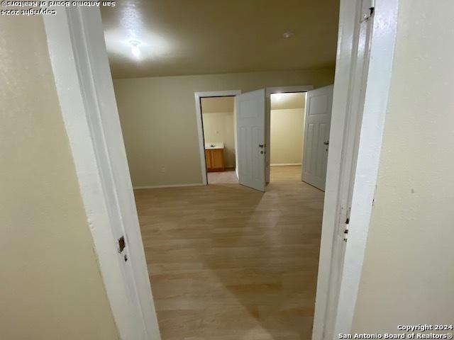 hallway featuring light hardwood / wood-style floors