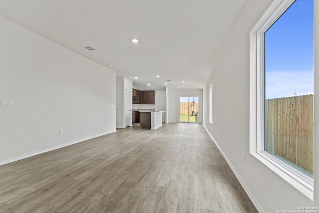 unfurnished living room featuring light wood-type flooring