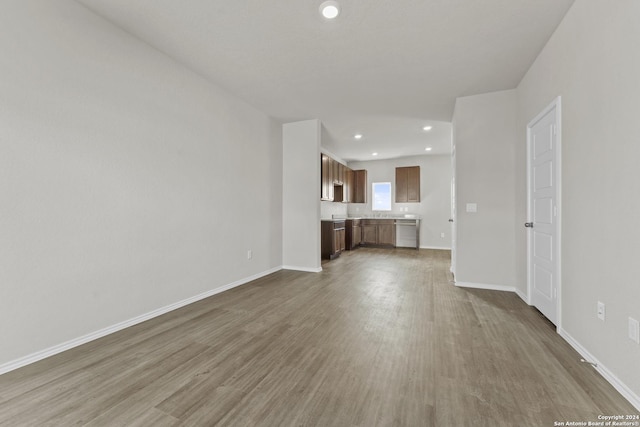 unfurnished living room with wood-type flooring