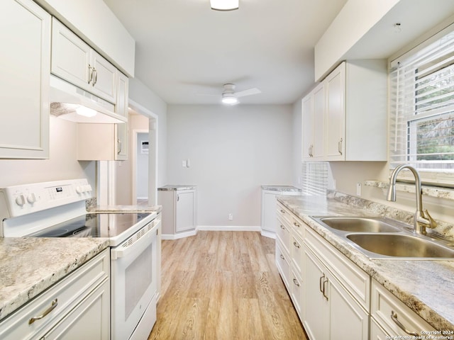 kitchen with light wood-type flooring, ceiling fan, sink, white cabinets, and white range with electric cooktop