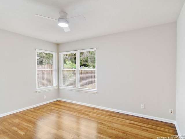 empty room featuring hardwood / wood-style floors and ceiling fan