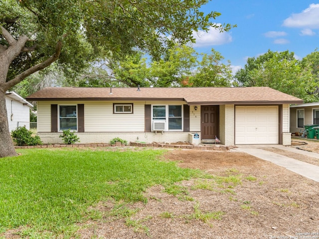 single story home with a front lawn and a garage