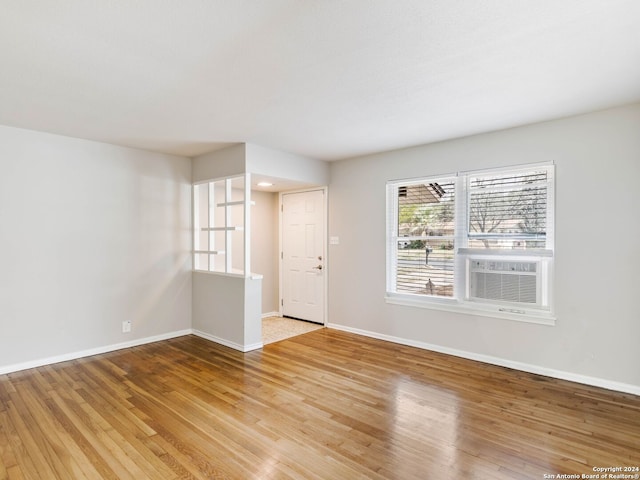 unfurnished room with light hardwood / wood-style floors