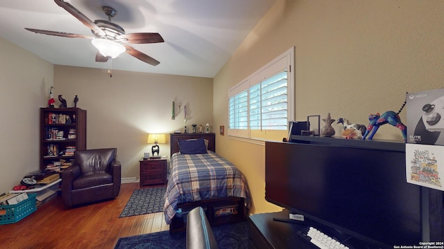 bedroom featuring ceiling fan and hardwood / wood-style floors