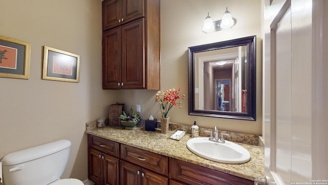 bathroom with vanity and toilet