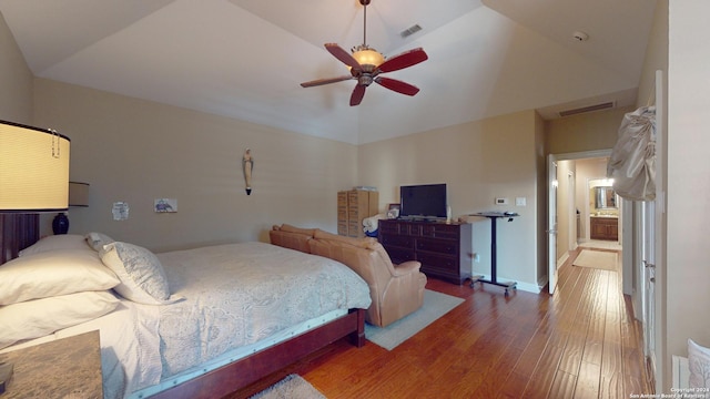 bedroom featuring lofted ceiling, hardwood / wood-style floors, and ceiling fan