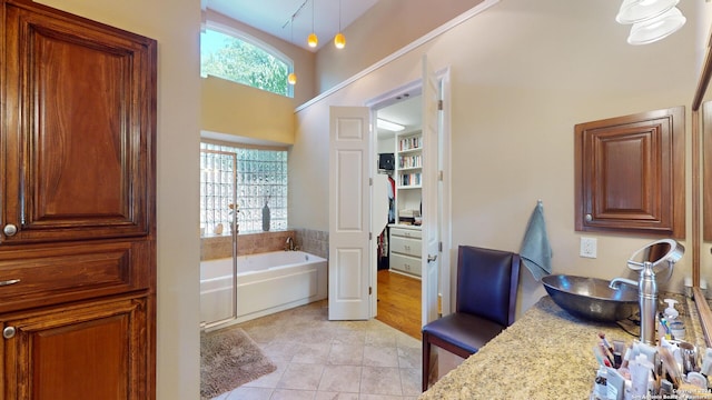 bathroom featuring tile patterned flooring and a tub