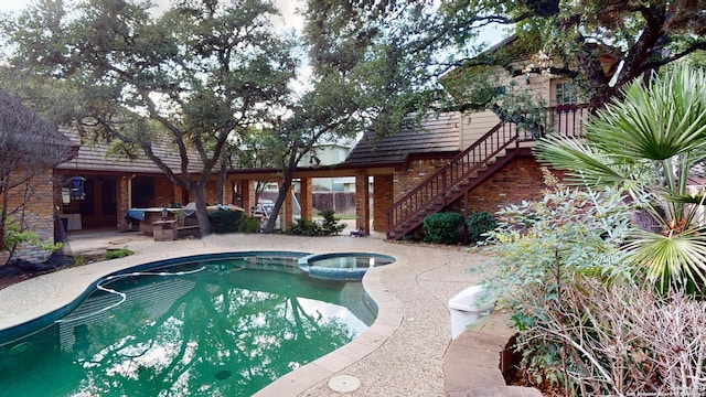 view of swimming pool with a patio