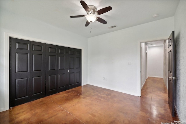 unfurnished bedroom with a closet and ceiling fan