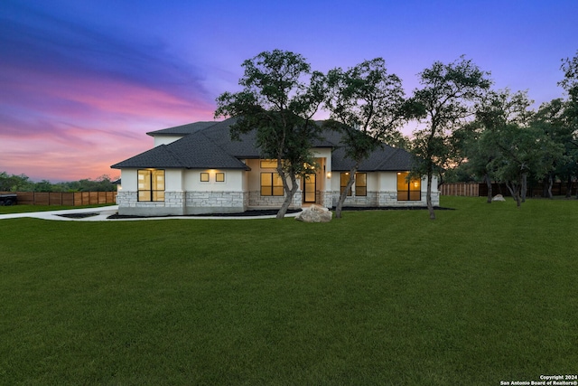 view of front of home with a yard