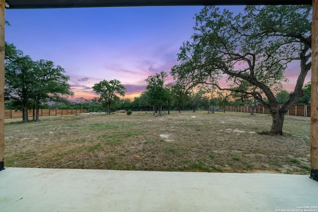 view of yard at dusk