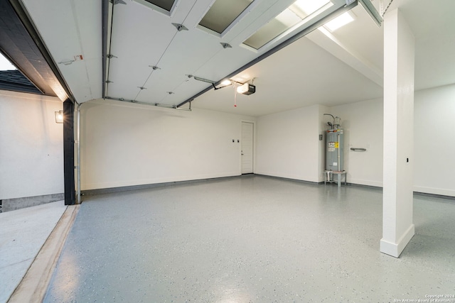 garage with a garage door opener and water heater