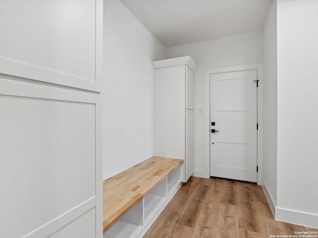 mudroom with light hardwood / wood-style floors