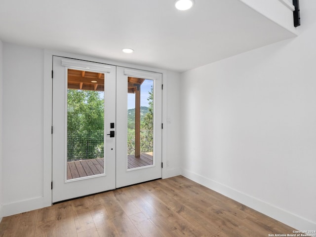 entryway featuring french doors and light wood-type flooring