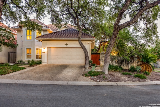 mediterranean / spanish-style house featuring a garage