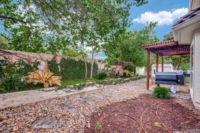 view of yard featuring outdoor lounge area, a pergola, and a shed