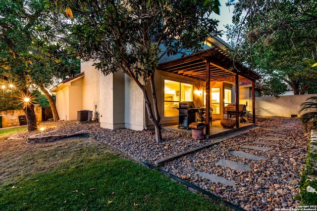 back of house featuring central air condition unit