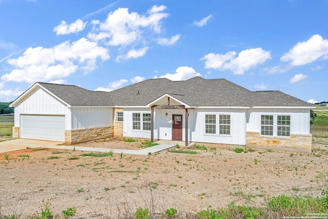 ranch-style house featuring a garage