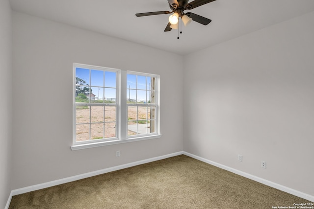 unfurnished room with ceiling fan and carpet floors