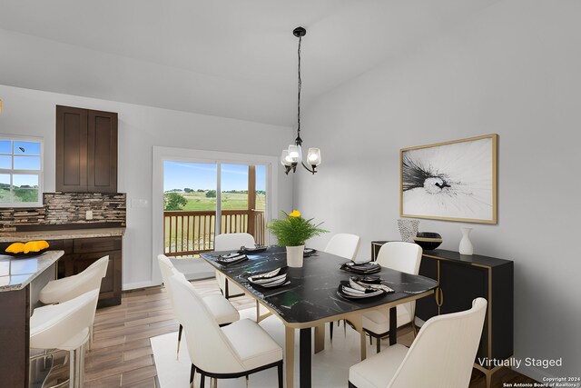 unfurnished room featuring wood-type flooring, ceiling fan, and vaulted ceiling