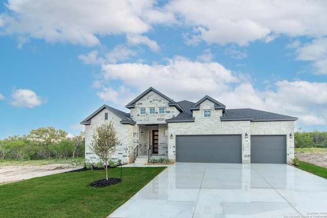 view of front facade featuring a front yard and a garage