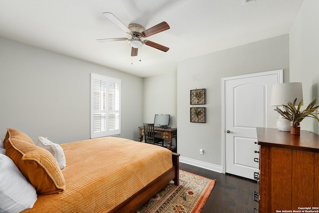 bedroom featuring ceiling fan and dark hardwood / wood-style flooring