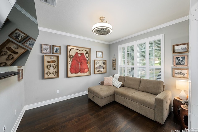 living room featuring crown molding and hardwood / wood-style flooring