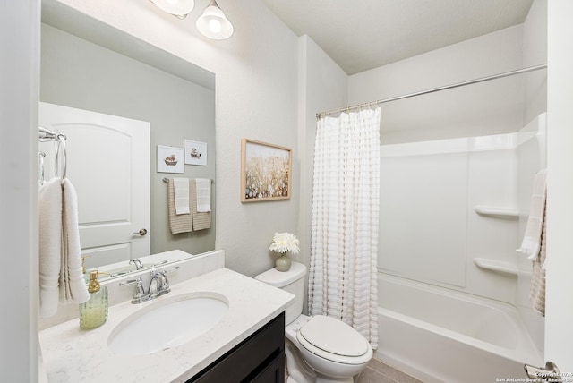 full bathroom featuring shower / bath combo, vanity, a textured ceiling, and toilet